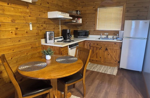 Eureka Springs Cabin | Tranquil Cabin- Perched on Mountain Top boasting jacuzzi for two and expansive deck with views! Trail & Cave on Property!