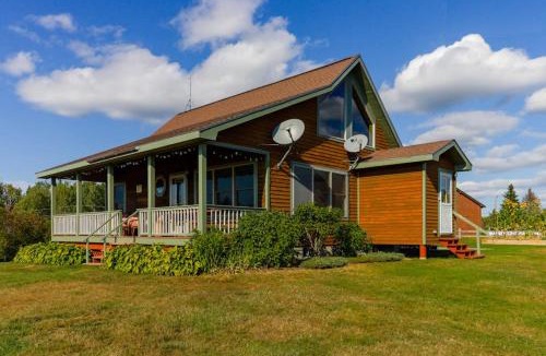 Greenville House | Two lakefront dog-friendly cabins on four acres with porches, dock, & lake views