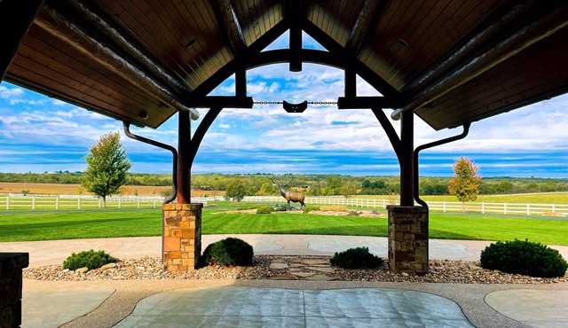 A one-of-a-kind Log Lodge on over 200 acres of panoramic views & serene settings