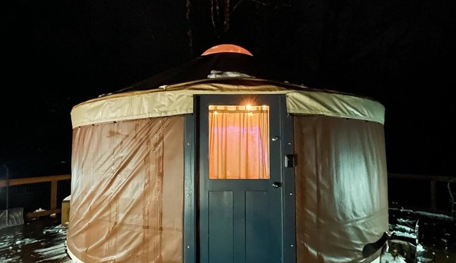 A yurt in the trees. Close to Portland but close to nature. Treeyurt Maine