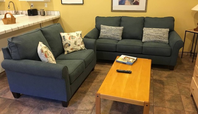 Affordable, end unit on courtyard in desirable La Cabaña! Steps From beach