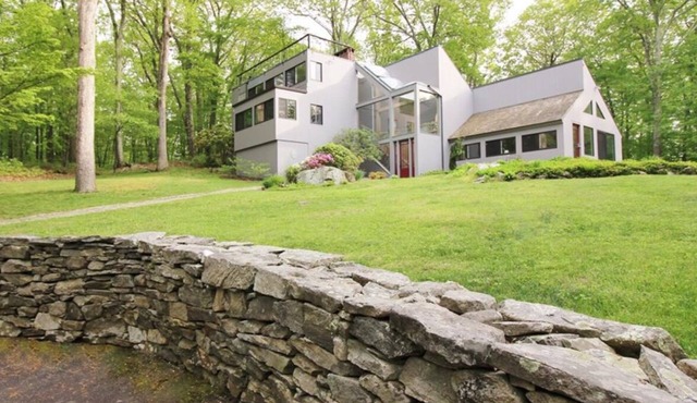 Architectural woodland retreat with trails, sauna, theater