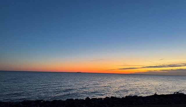 Awesome Sunrise from our peaceful waterfront 3 bed- 2.5 bath home, with Tiki Bar