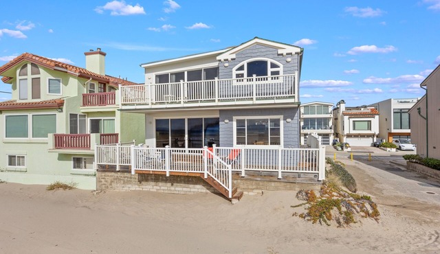 Beachfront abode with spacious deck, pool table, gas grill, smart TVs, & W/D
