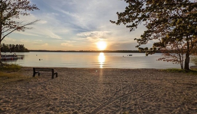 Beautiful home with 150ft sandy beach and private boat launch on Big Sebago!