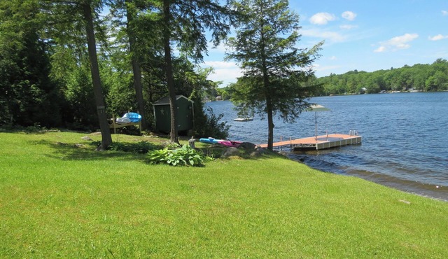 Beautiful lakeside 4 bedroom retreat with private dock and walkout basement