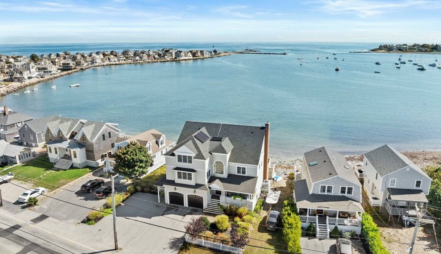 Breathtaking harbor views from spacious beachfront home.