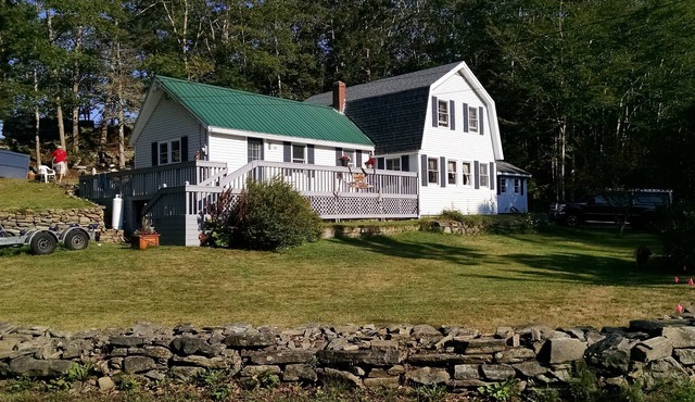 Classic Maine House, wrap around deck, water activity a walk away.