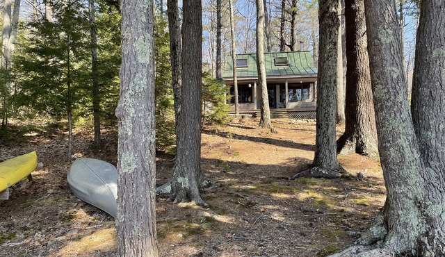 Classic Maine Lake Cottage with two beaches on 8 private acres.