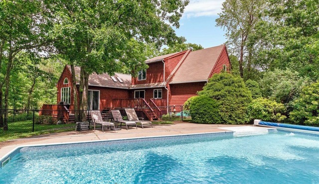 Contemporary Hampton Bays home on one acre of manicured lawn, private pool,.