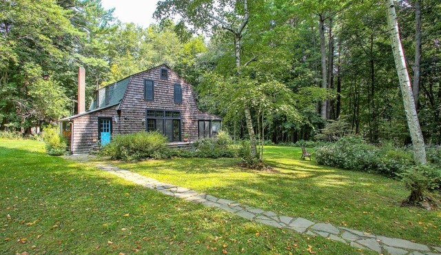Cottage-style home, beautiful landscaping, large screened porch, fire pit,...