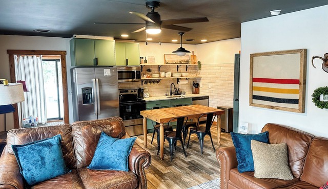 Cozy 2BR/2BA cabin tucked in the trees with hot tub, fire pit, covered deck, and fast WiFi.