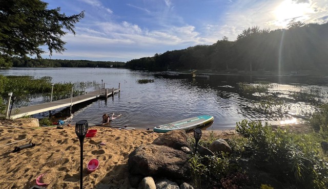 Cozy home with private beach on Huntress Pond and short drive to skiing!