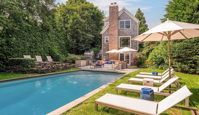 Elegant Coastal Escape with Expansive Yard, Heated Pool, and Outdoor.