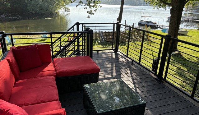 Enjoy a spectacular view of Burden Lake, NY while relaxing inside or outside.
