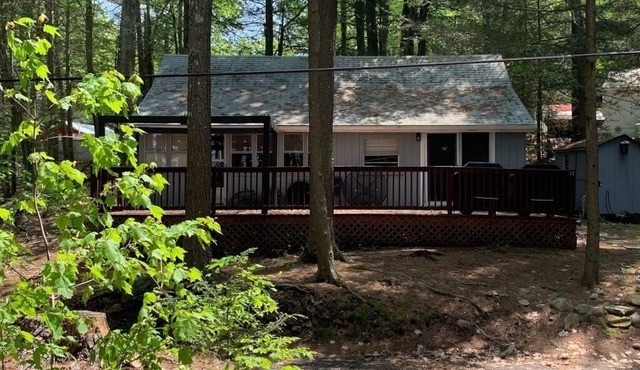 Enjoy being serenaded by loons at this rustic Northwood lake view cottage!