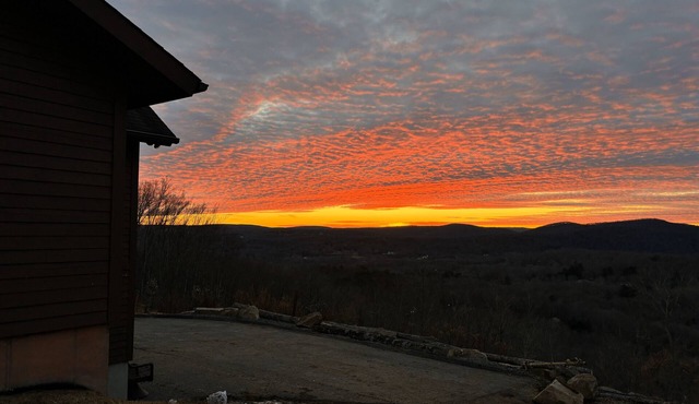 Escape to a one-of-a-kind Mountaintop Retreat with panoramic westerly views