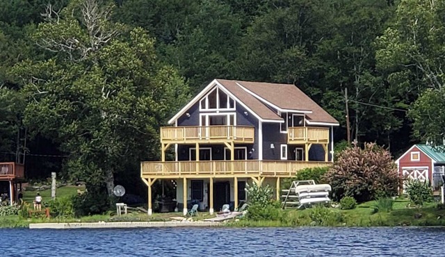 Experience Lakeside Living with a Perfect Blend of Rustic Charm & Modern Luxury