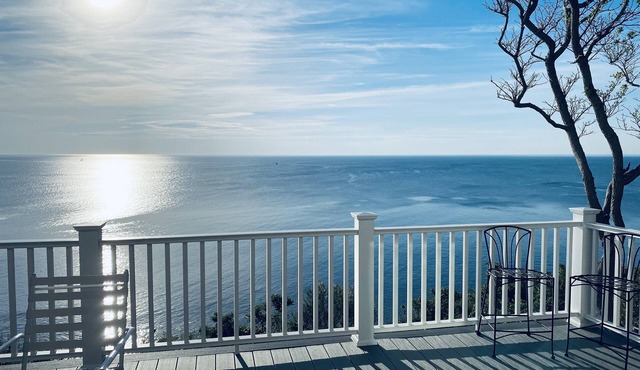 Home with spectacular panoramic ocean views from a bluff high above Cape Cod Bay