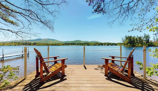 Homey lakeside property w/one house, two cottages, mtn. views, & private beach