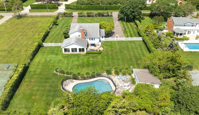 Idyllic traditional home with spacious rooms, fenced yard, and private pool.