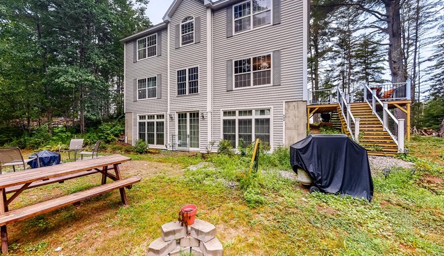 Idyllic waterfront home with furnished deck, grill, sweeping views & private W/D