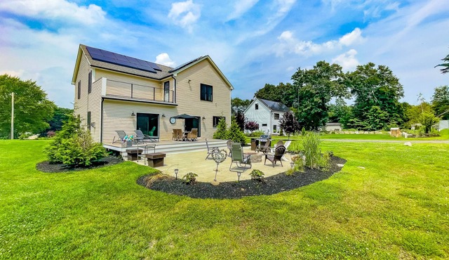 Inviting house in Salisbury with EV charger, balcony, firepit, and gas grill