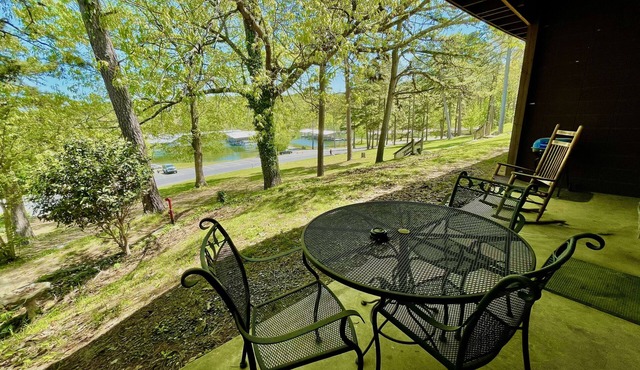 King Studio with king bed, dining area, sleeper sofa and view of Lake Ouachita by RedAwning