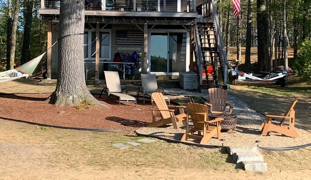 Lake Winnisquam home with beach and private boat dock. 15 minutes to Gunstock.