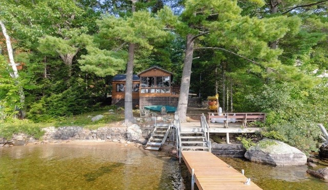 Lakefront cabin on Brandy Pond with dock, deck, firepit, kayaks & paddleboard