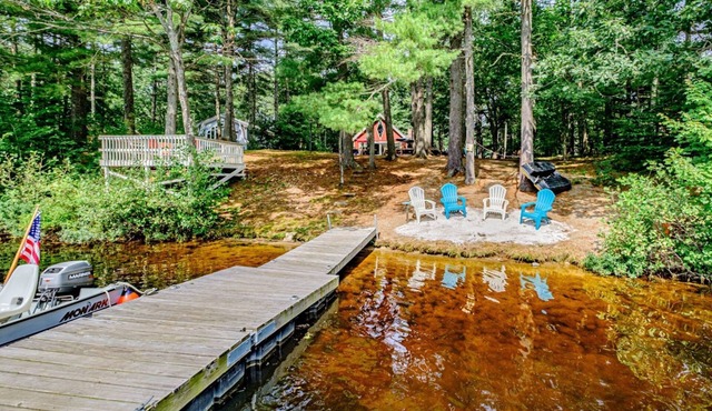 Lakefront dog-friendly home with dock, waterfront deck, wood fireplace, & W/D