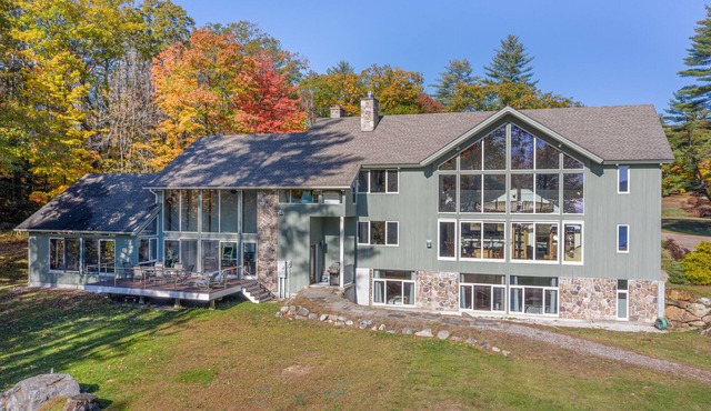 Lakefront home with gym, game room, home theatre, & private beach with boathouse