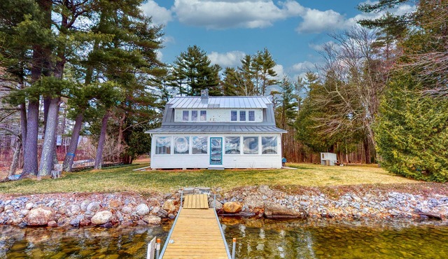 Lakefront home with private dock, kayaks, firepit, grill, & sunroom