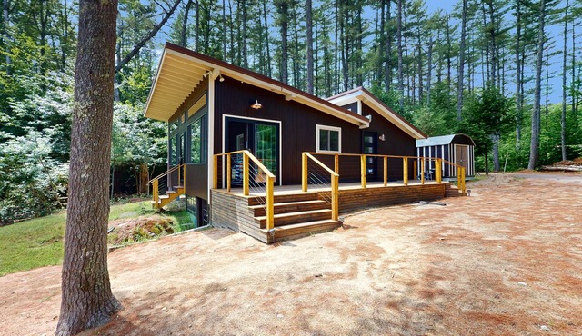 Lakefront house with firepit, beach access, deck, grill, woodstove, & central AC