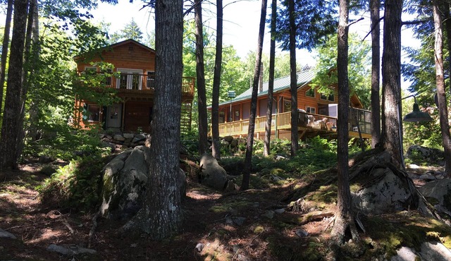 Log home on untouched cold stream lake