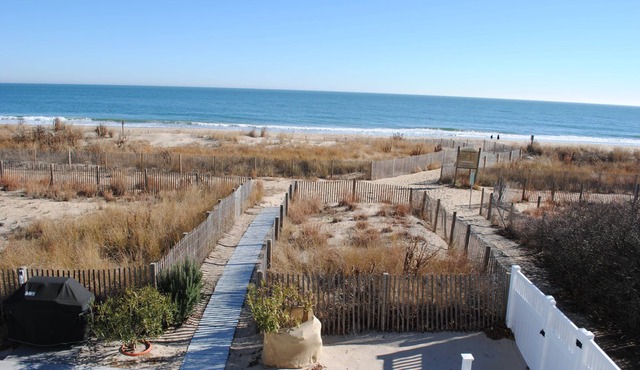 Modern, stylish 4 bedroom oceanfront end-unit townhouse with free WiFi, outdoor pool, playground, and downstairs apartment with gorgeous ocean view and only steps from beach!