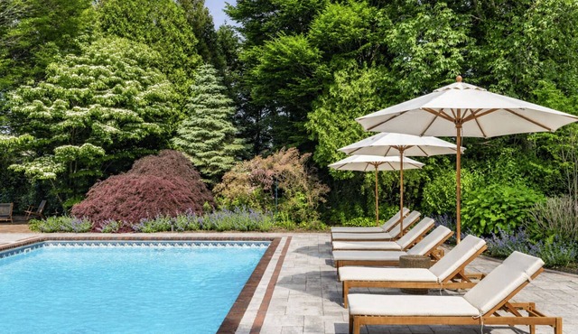 Quintessential Hamptons home with 6 bedrooms (all ensuite bathrooms), open.