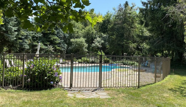 Relaxation Awaits-Fully renovated home heated pool, private manicured grounds.