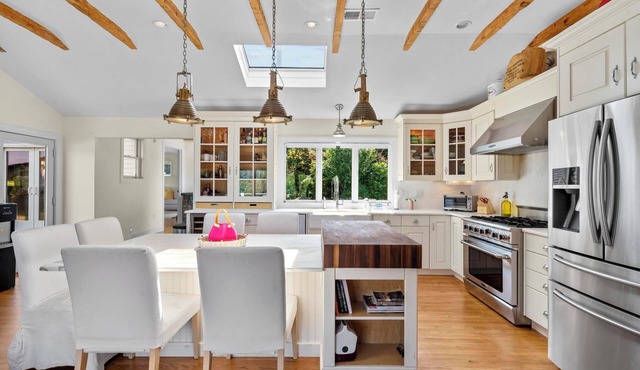 Spacious 4-BR house in lake community with beach access and swim-in-place spa.