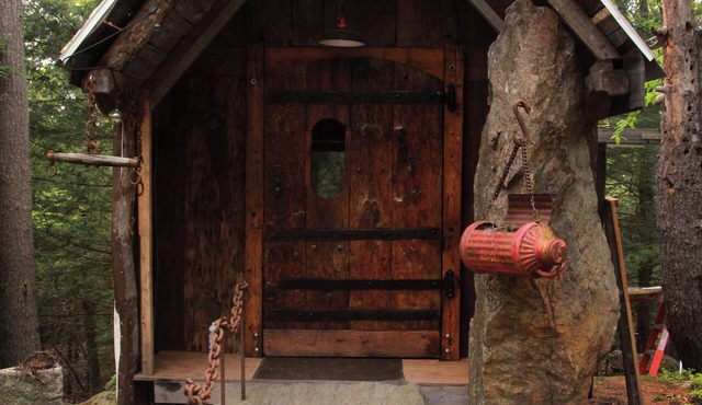Stone Haven "Tent Cabin" with a cast iron fire pit in Canterbury, NH.