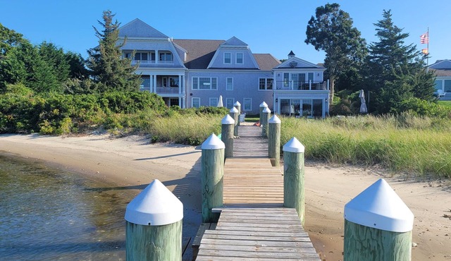 Stunning waterfront with sandy beach & dock walking distance to top restaurants!