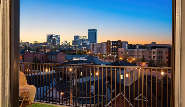Summer rooftop deck, skyline views, garage-door kitchen near Broadway