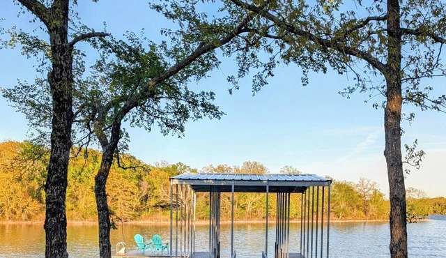 The Lake House is a Private Lake Escape with Covered Dock+Swim Platform+Fire Pit