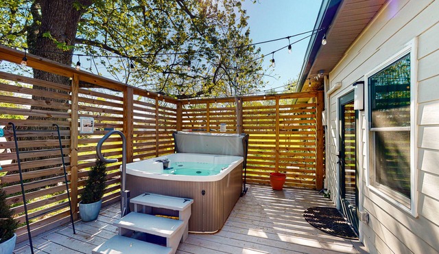 Tranquil home with private hot tub, sunroom, den, office & lovely backyard
