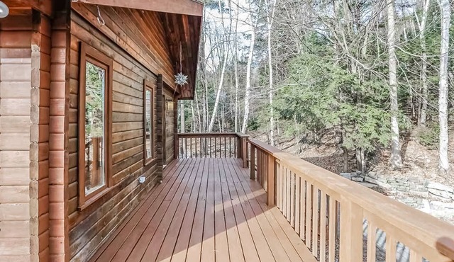 Tranquility, stone fireplace, lofted ceilings, wall of windows, & views