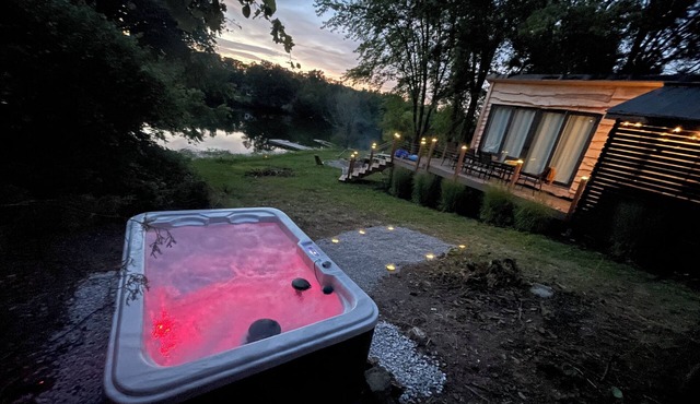 Unplug and unwind in this charming loft cabin nestled on the water’s edge.