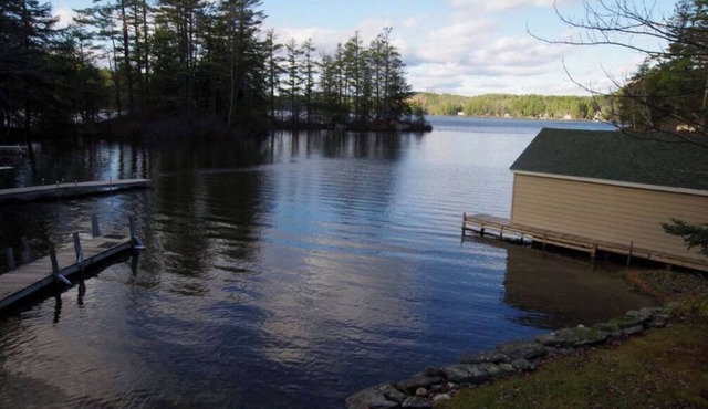 Waterfront property on pond with private dock .
